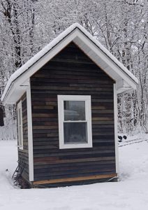 Writing shed covered and surrounded by snow.